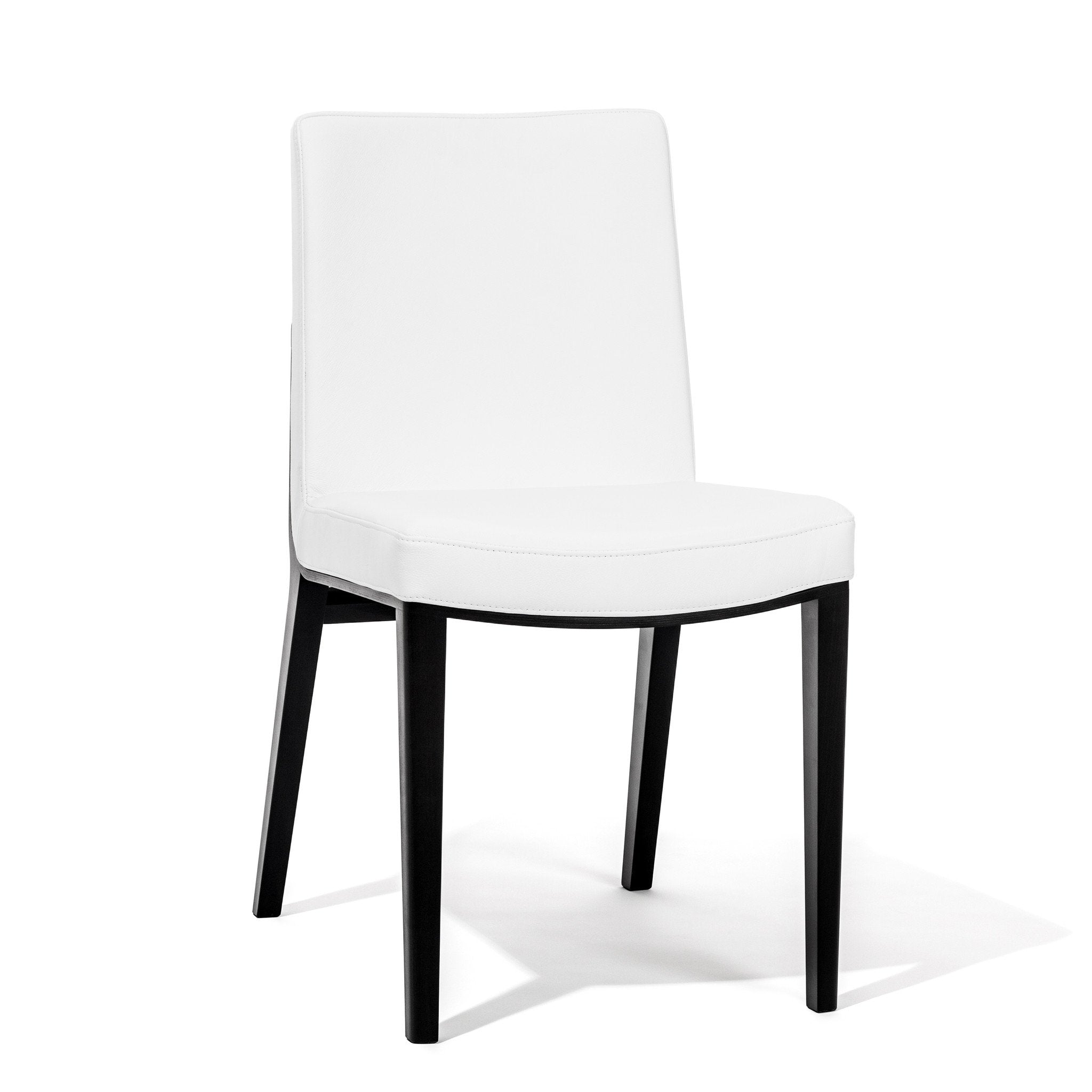 The Chair Moritz by TON showcases sleek modernity with its white upholstered seat and backrest. It features a minimalist design with straight black wooden legs and clean lines, making it perfect for contemporary interiors and lovers of premium products.