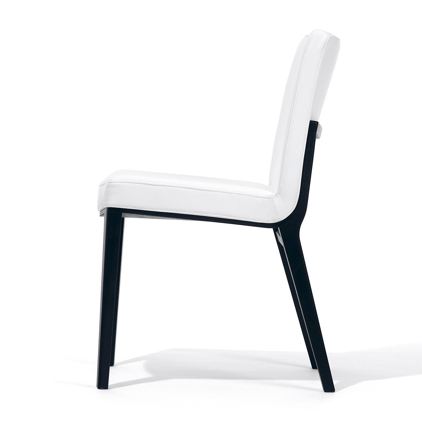 The Chair Moritz by TON features a sleek black frame and a white cushioned seat and backrest, showcased beautifully from the side against a pristine white background.