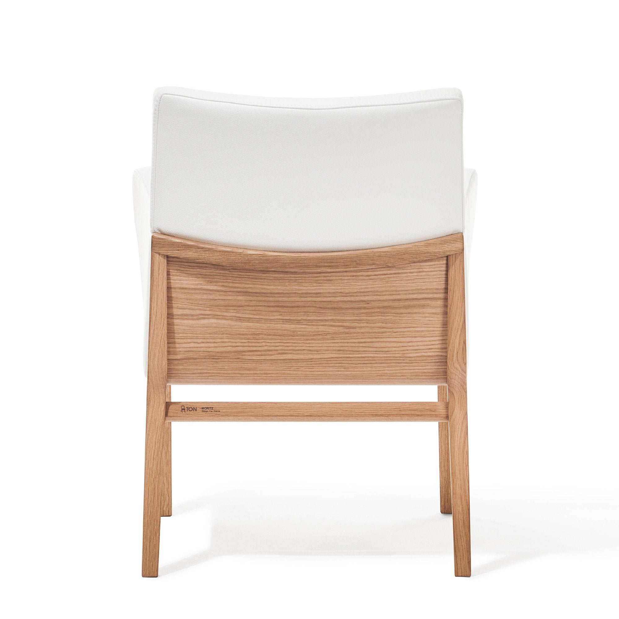 Back view of the Chair Moritz by TON, showcasing a wooden frame with a light brown finish and white cushioned upholstery. As part of the TONDesigner collection, its sleek design highlights minimalism and comfort, underlining its status as a premium product.