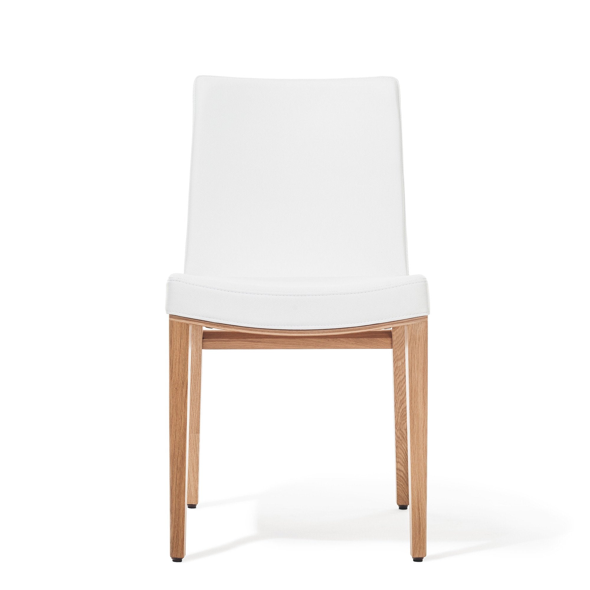 The Chair Moritz by TON combines a white upholstered seat and backrest with light wooden legs, offering a minimalist design perfect for contemporary interiors that value premium aesthetics.