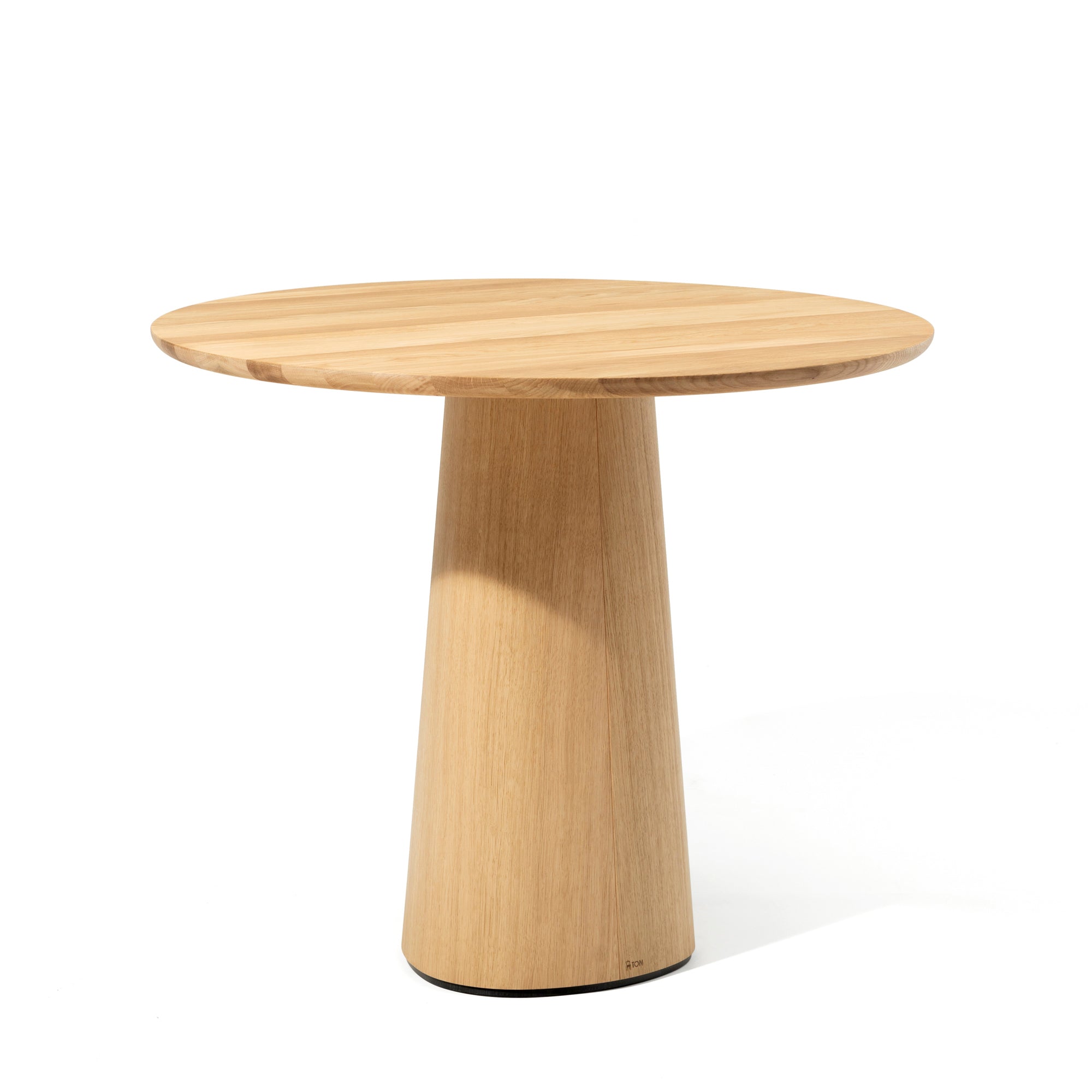 The P.O.V. Table 460 by TON is a small round wooden table featuring a smooth surface and an organically shaped conical base, placed against a plain white background.