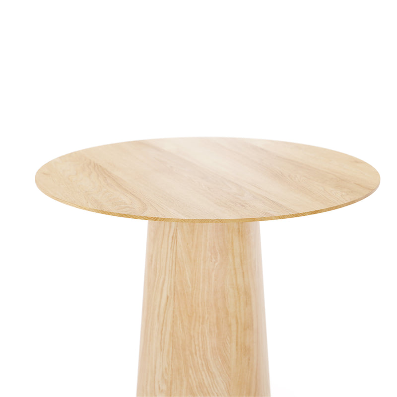 The P.O.V. Table 461 by TON is a round wooden table with a light, natural finish and an organically shaped conical base. Its smooth, flat top highlights the wood grain pattern beautifully against a plain white background.