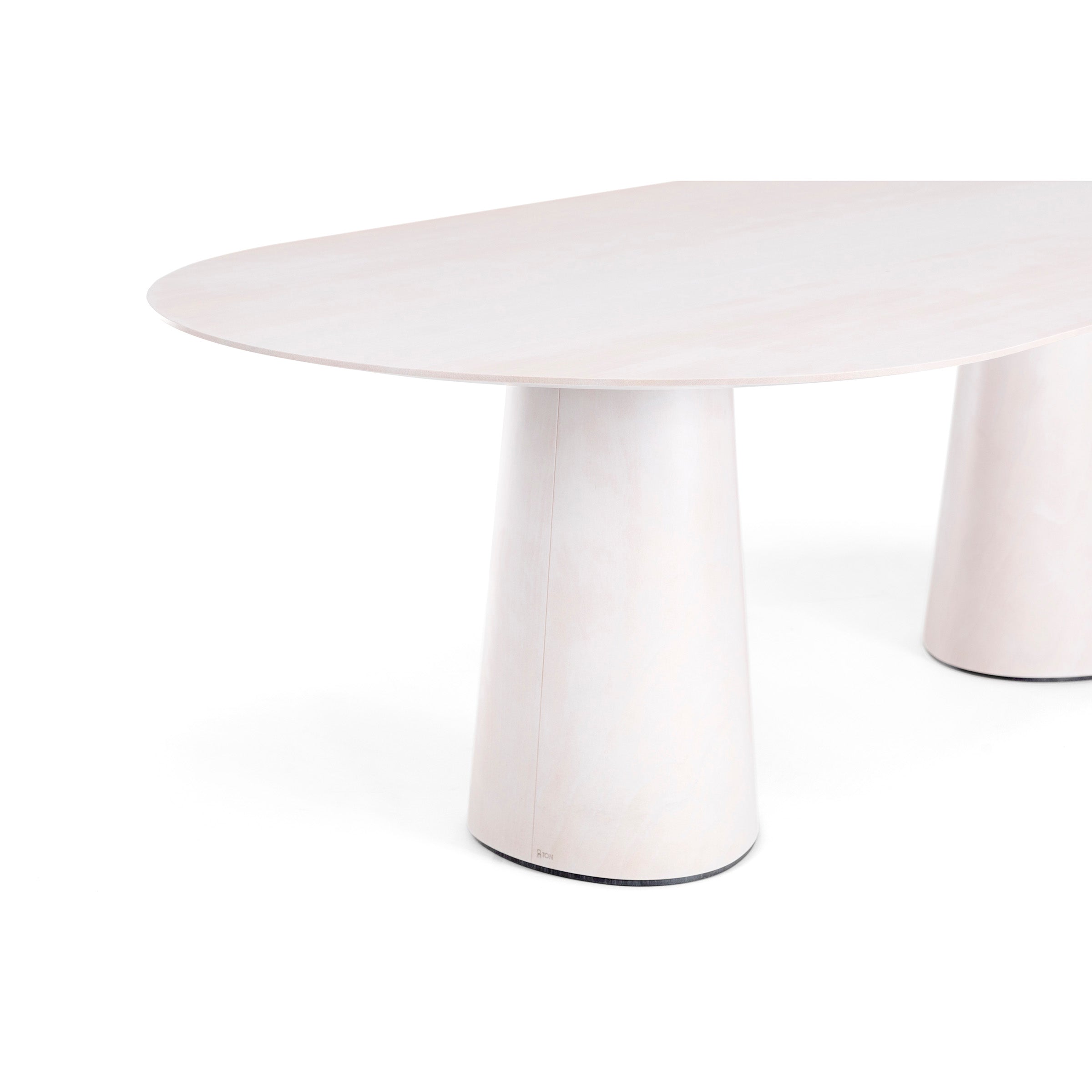 The P.O.V. Table 464 by TON is a modern, minimalist piece featuring an oval top with an organically shaped base supported by two cylindrical legs, crafted from light-colored wood and standing against a plain white background.