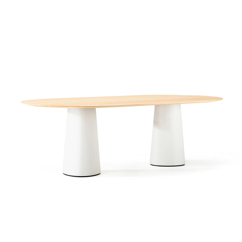 The P.O.V. Table 464 by TON showcases a minimalist design with a light wood oval top and two wide cylindrical legs on an organically shaped base, set against a plain white background for a fresh take on modern decor.