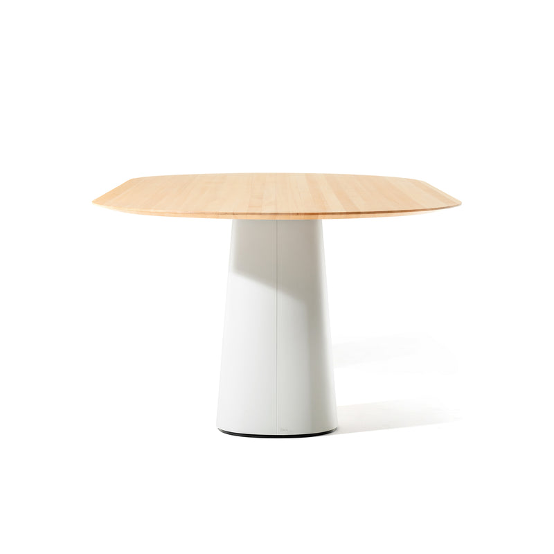 The P.O.V. Table 464 by TON boasts a round wooden top with a light natural finish, elegantly supported by an organically shaped white conical pedestal base, all set against a plain white backdrop.