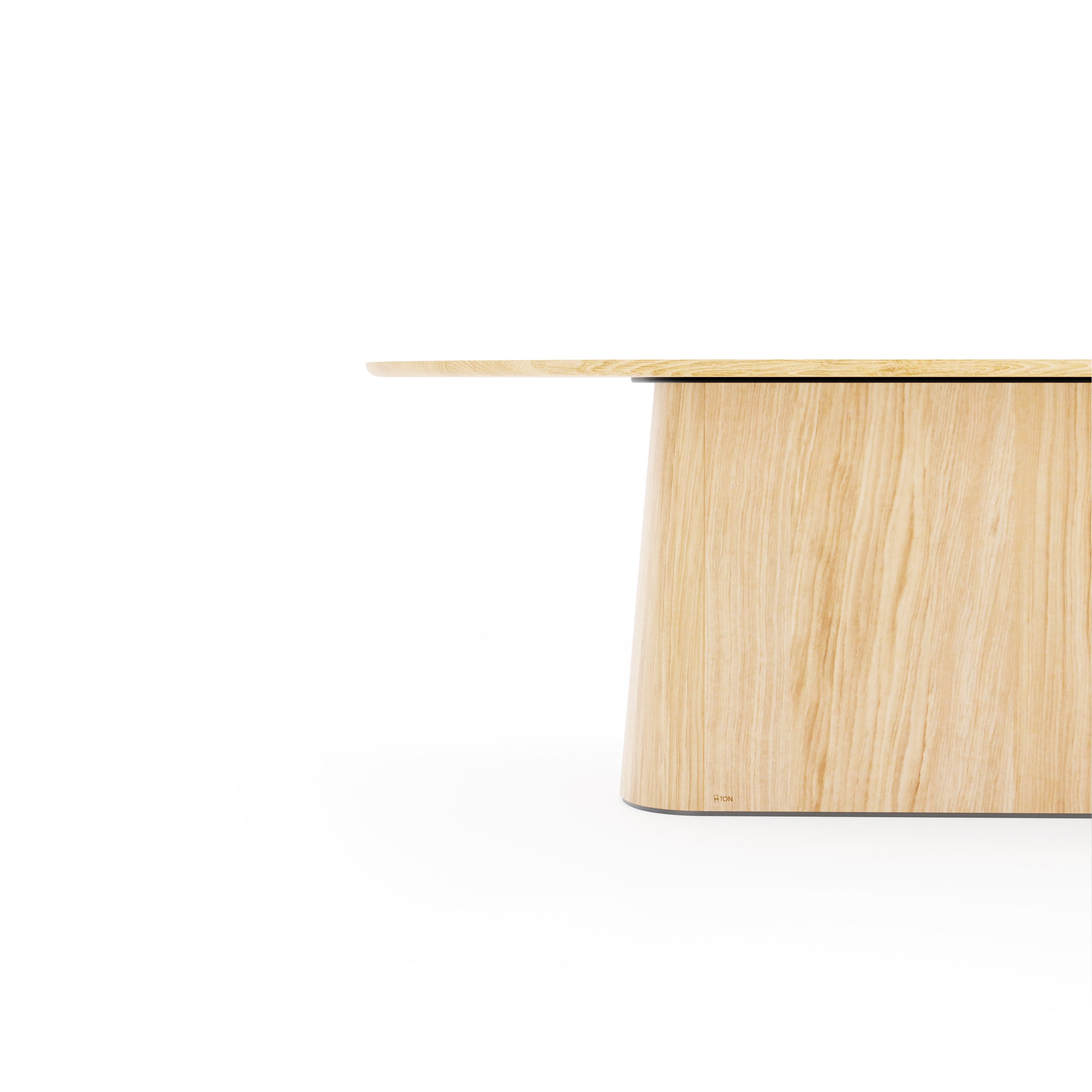 The P.O.V. Table 465 by TON is a minimalist wooden table with an organic design, featuring a cylindrical base and solid wood tabletop in a natural finish. The visible wood grain enhances its understated elegance against the plain white background.