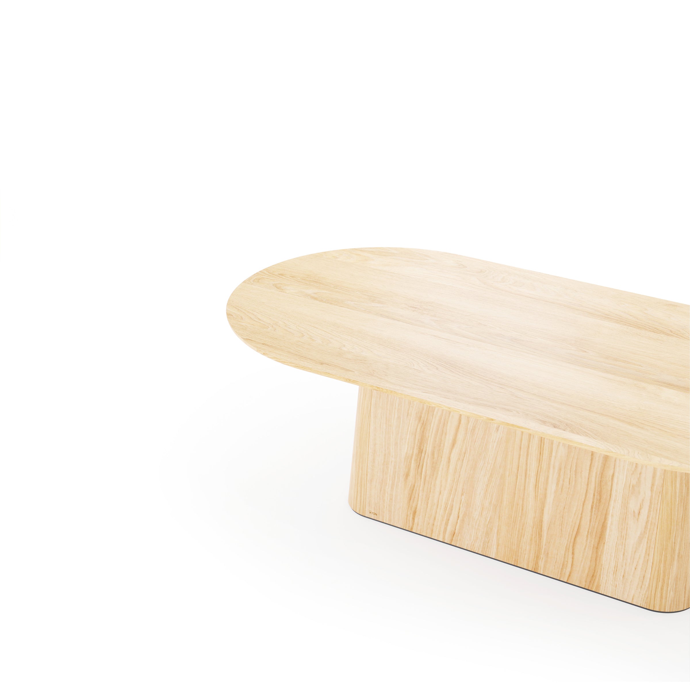 The P.O.V. Table 465 by TON, set against a plain white background, features an organic design with a light wood grain finish and solid wood tabletop. This wooden oval coffee table has a flat top with rounded edges and rests on a matching rectangular base.