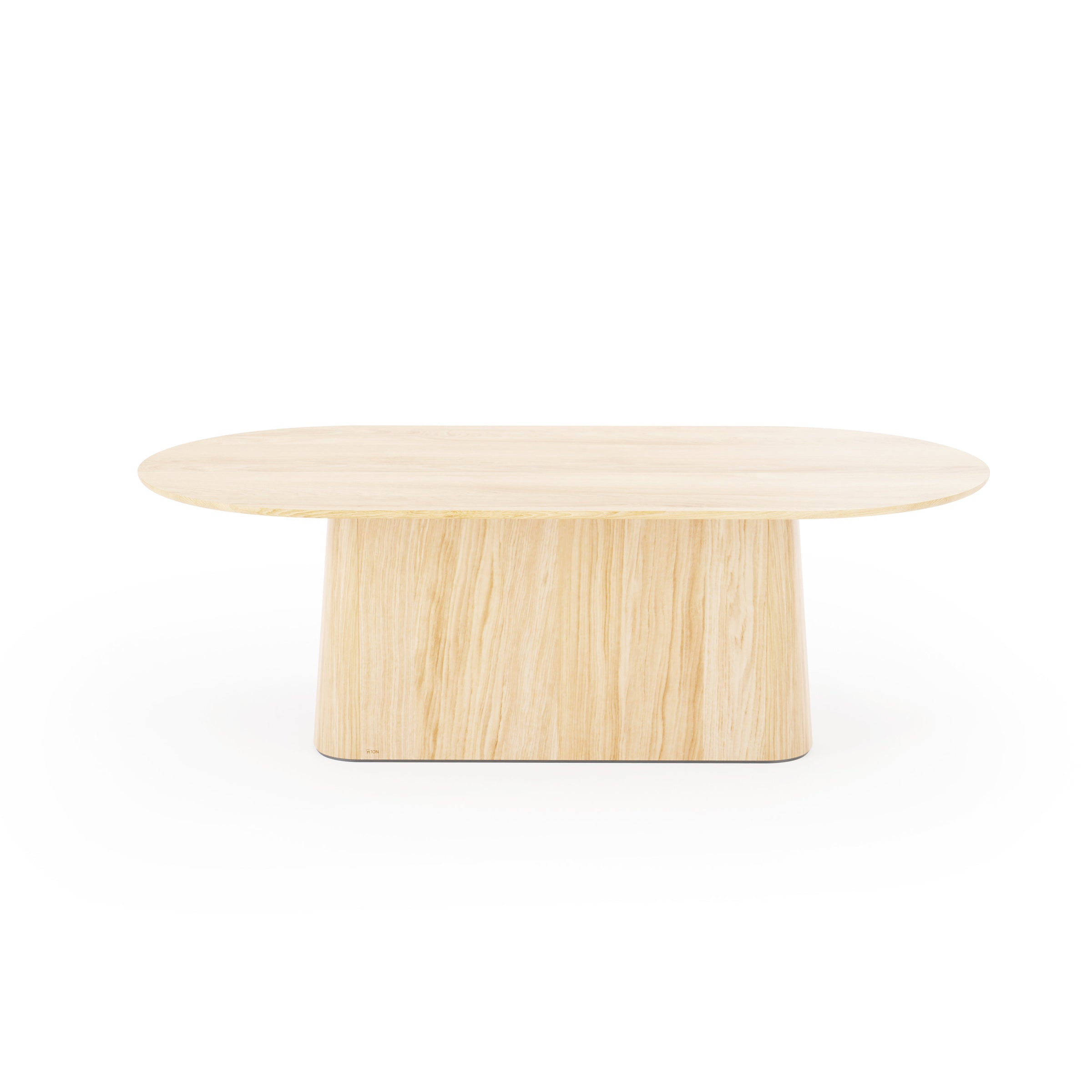 The P.O.V. Table 465 by TON is an oval wooden coffee table featuring a light-colored finish. Its solid wood tabletop is supported by a sturdy, tapered vertical base that highlights the natural wood grain, showcasing an organic design.