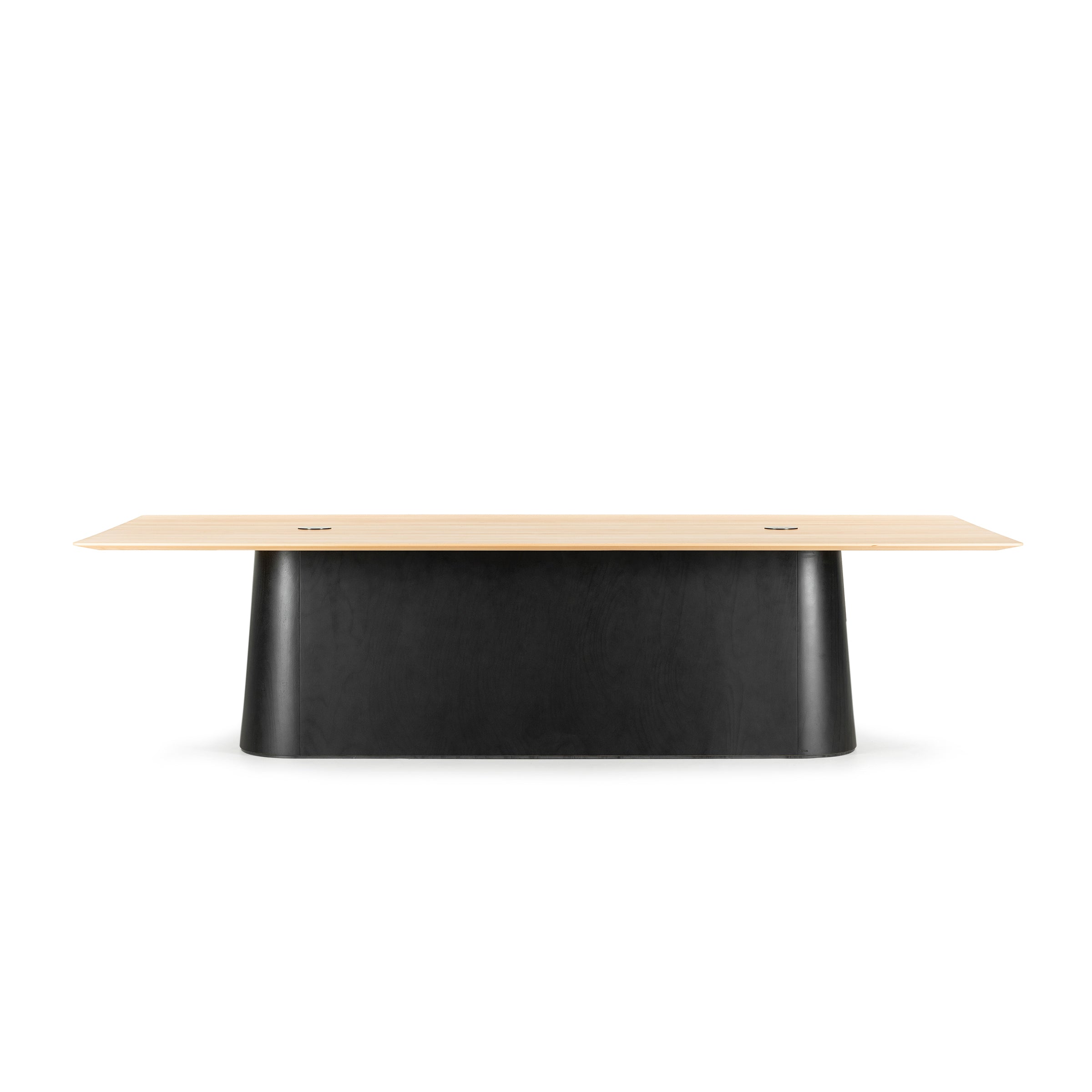 The P.O.V. Table 467 by TON is a modern rectangular conference table with a minimalist modular design, featuring a light solid wood top and sleek black base, ideal for office or meeting room settings.