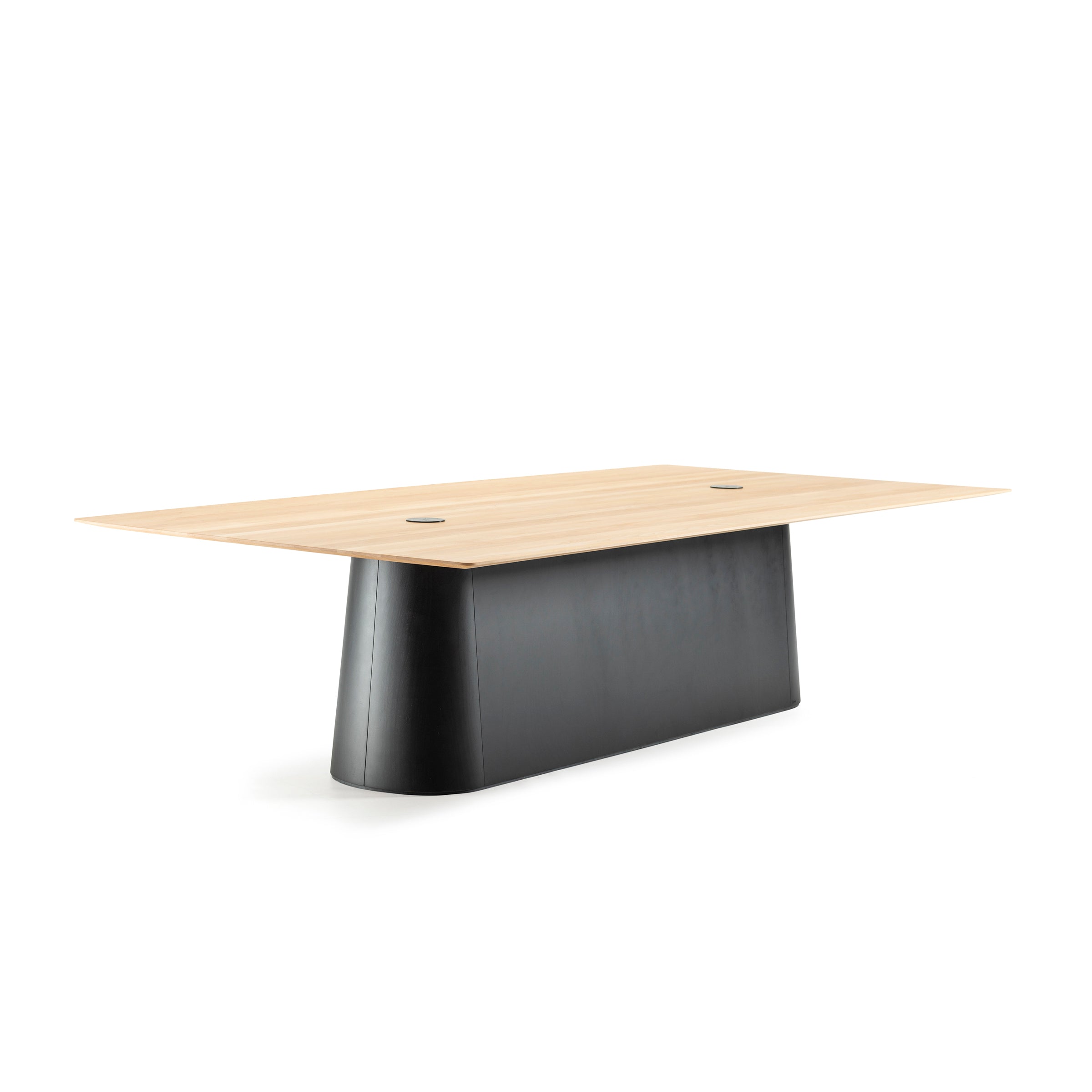The P.O.V. Table 467 by TON is a modern rectangular piece with a light solid wood top featuring round cutouts, supported by a wide, black, organic base.