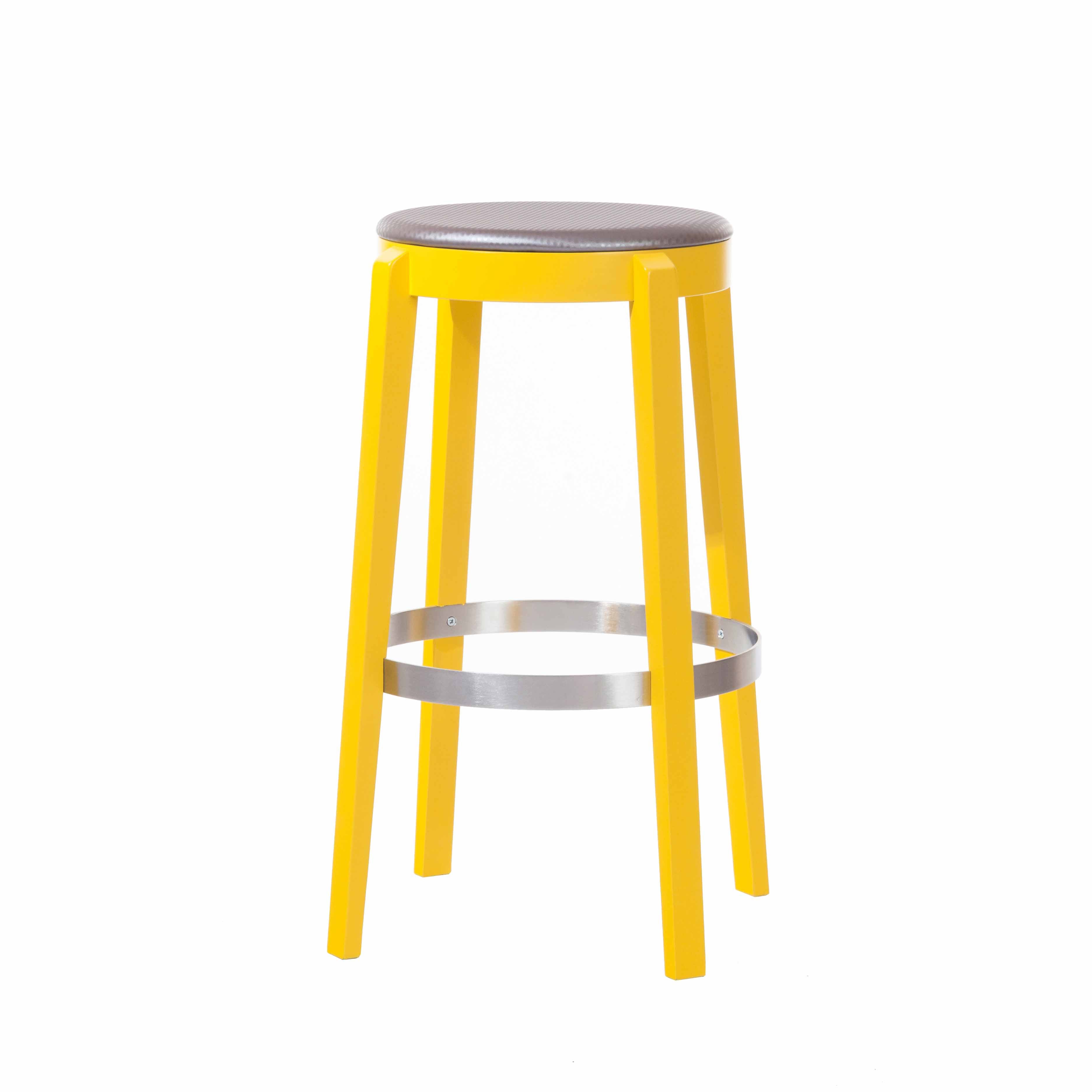 The Barstool Punton - Sale from TON features a modern design with a tall, bright yellow frame, round gray cushion, and circular metal footrest. It has four Punton-style legs and is set against a plain white background.