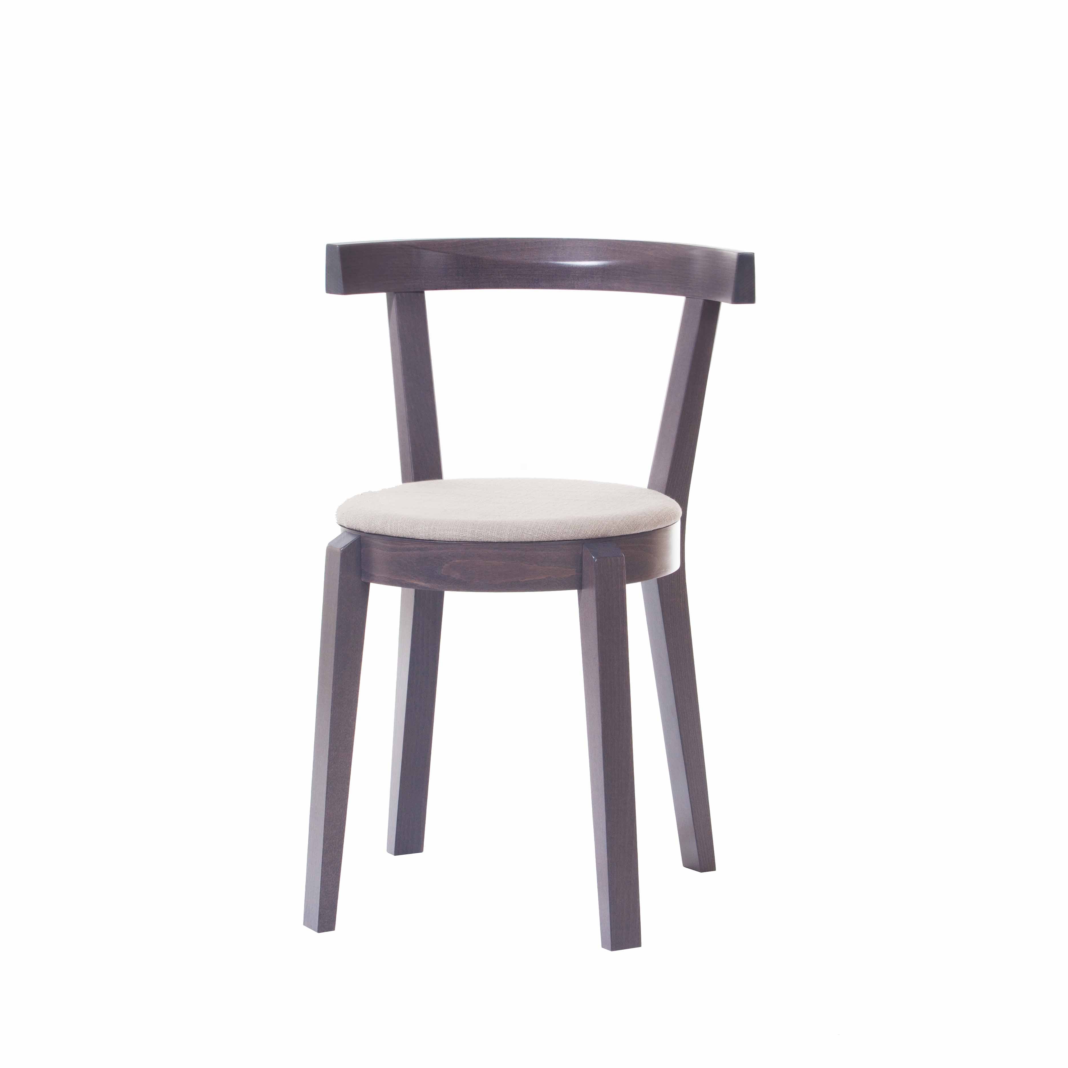 The Chair Punton by TON features a dark brown wooden finish, a light beige cushioned round seat, and a curved backrest reminiscent of classic bent furniture. It stands on four straight legs.