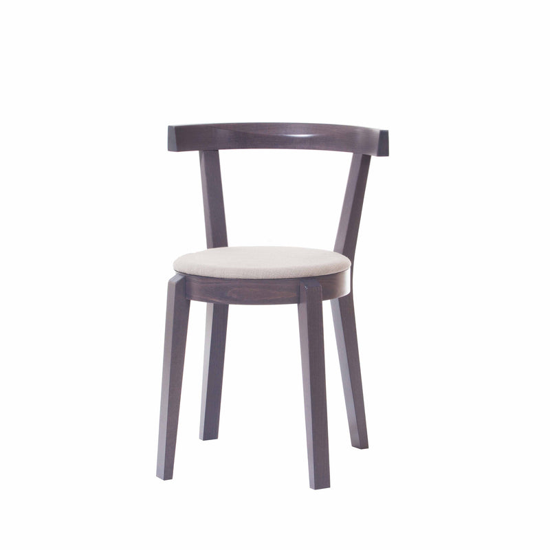 The Chair Punton by TON features a dark brown wooden finish, a light beige cushioned round seat, and a curved backrest reminiscent of classic bent furniture. It stands on four straight legs.