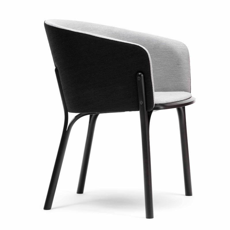 The Armchair Split - Sale by TON is a modern chair with an ergonomic design, featuring a black wooden frame and a two-tone fabric backrest in light gray and dark gray. Its manual wood bending craftsmanship is highlighted in the smooth, curved structure of its four legs.