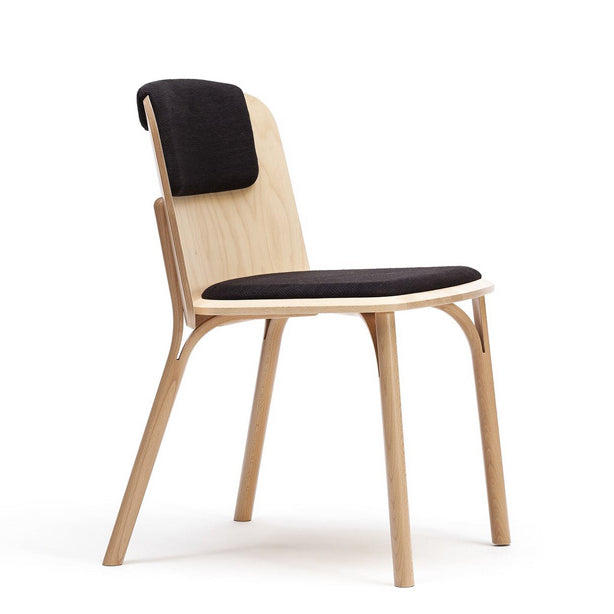 Discover the Chair Split by TON, a contemporary design marvel. This modern dining chair features light wooden legs and frame of manually bent wood, with a black cushioned seat and ergonomically curved backrest for added comfort.
