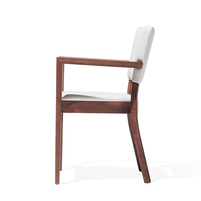 A side view of the Armchair Treviso from TON reveals its wooden frame and white upholstered backrest and seat. This minimalist design features straight lines, armrests, and is set against a plain white background.