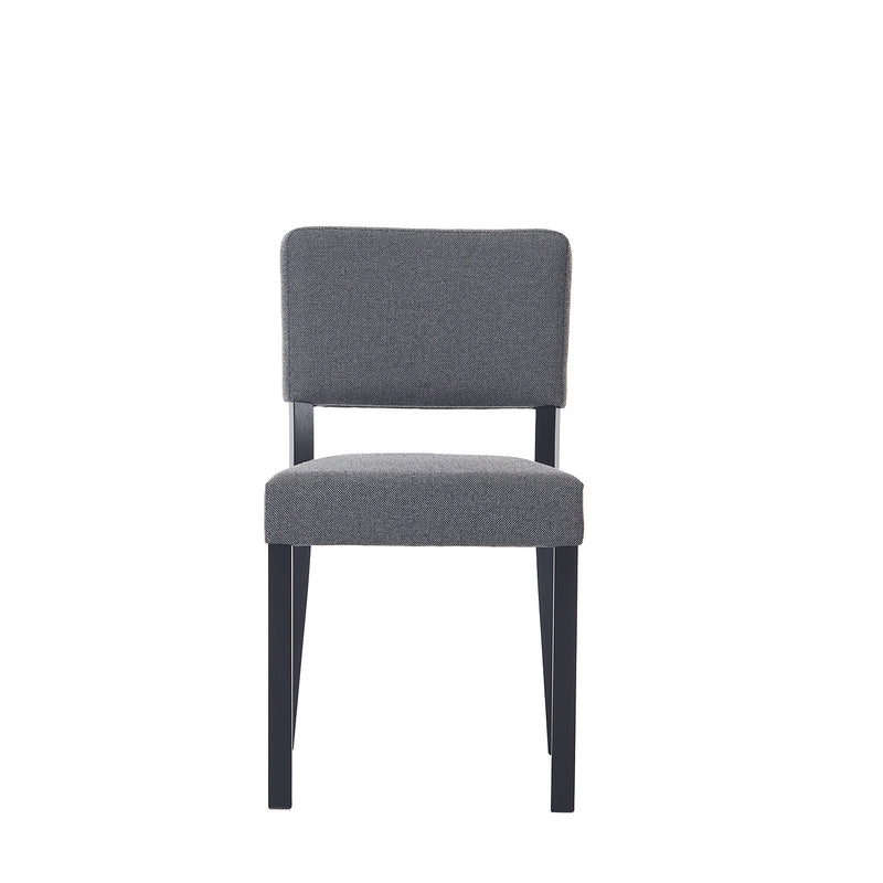 The Chair Treviso by TON showcases a minimalist design with a gray upholstered seat and backrest, complemented by sleek black legs. Positioned against a plain white background, this stylish piece enhances any modern dining space.