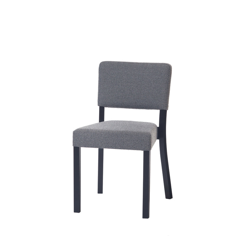 The Chair Treviso by TON showcases a modern design with a gray upholstered backrest and seat, supported by sleek black metal legs. Its minimalist style suits diverse settings like dining rooms or offices.
