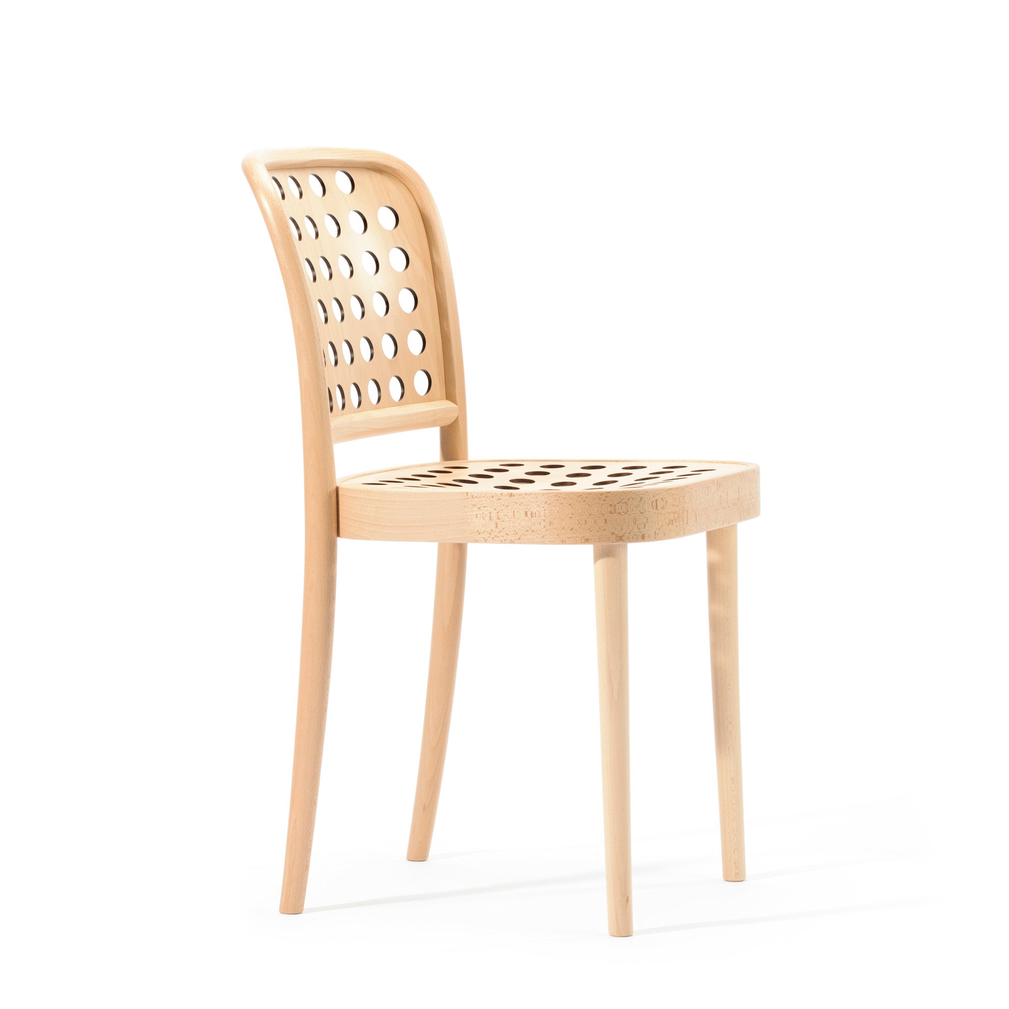 The Chair 822 by TON embodies Scandinavian minimalism with its curved backrest and drilled circular seat holes. Crafted using manual wood-bending technology, it features four legs and a minimalist design against a white background.