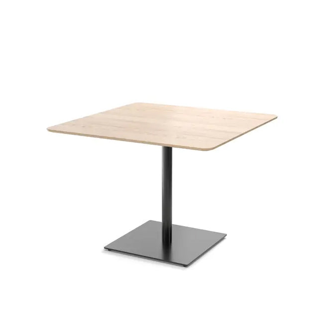 The Easy Bistro Table Rectangular by TON boasts a light oak-finished square wooden top supported by a black metal pedestal base on a sturdy platform, ideal for any casual dining area.