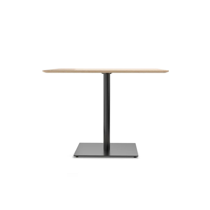 The Easy Bistro Table Rectangular by TON is a minimalist piece with a wooden square top and sleek black metal pedestal base, showcased against a plain white background.