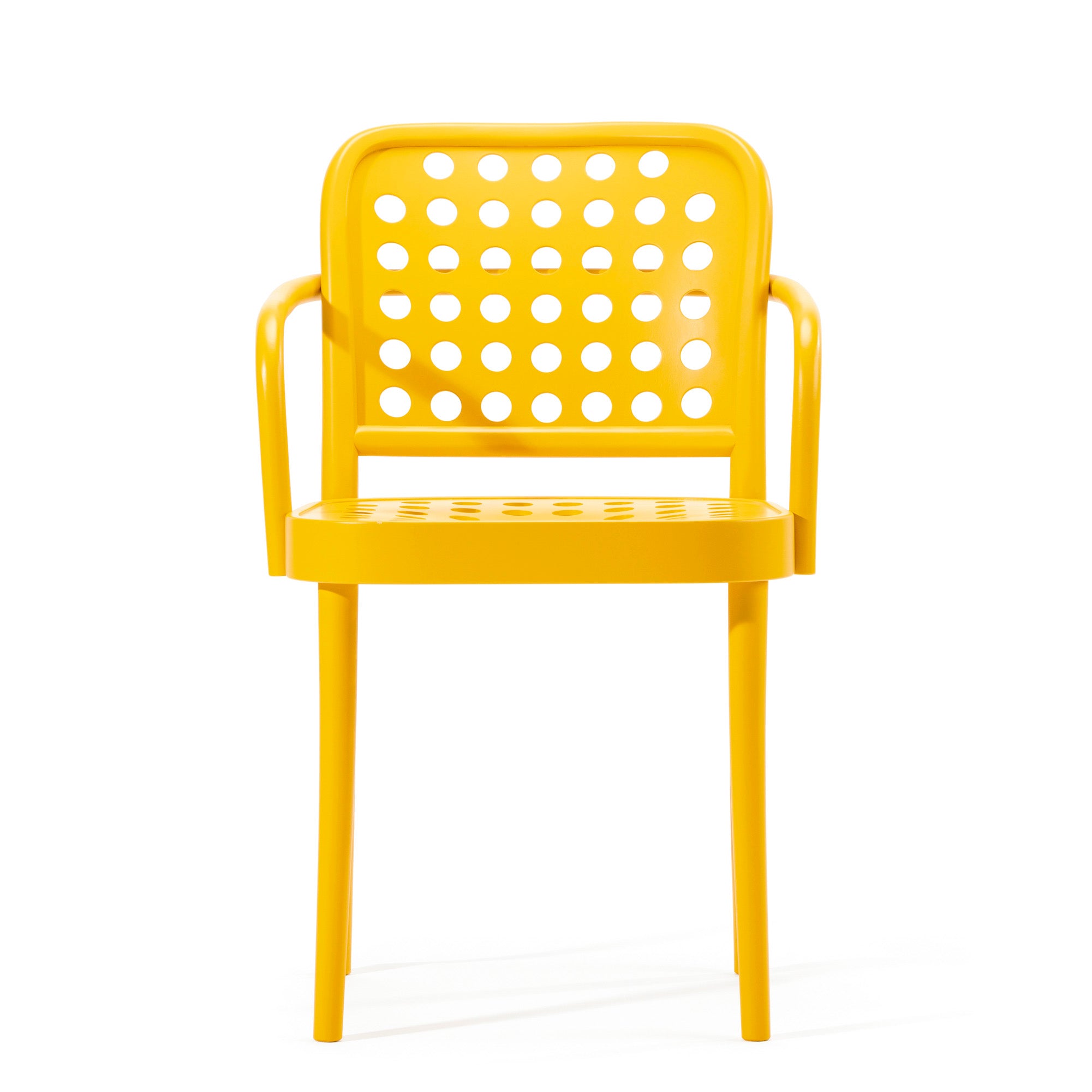 The Armchair 822 by TON is part of the TONDesigner seating collection, featuring a yellow plastic design with a perforated back, seat, rounded armrests, and four legs. Its modern look blends Scandinavian minimalism inspired by Claesson Koivisto Rune.