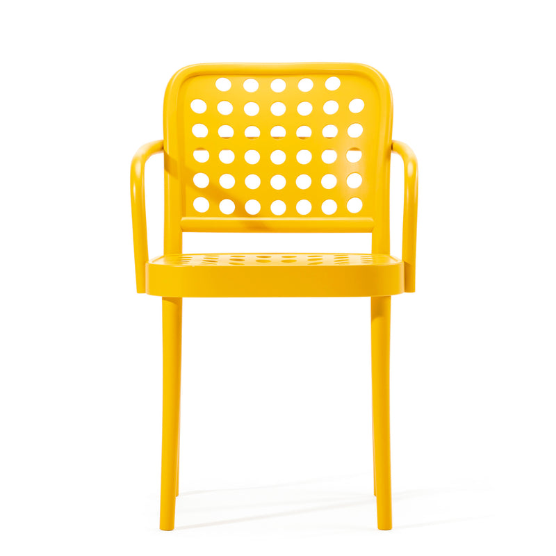The Armchair 822 by TON is part of the TONDesigner seating collection, featuring a yellow plastic design with a perforated back, seat, rounded armrests, and four legs. Its modern look blends Scandinavian minimalism inspired by Claesson Koivisto Rune.
