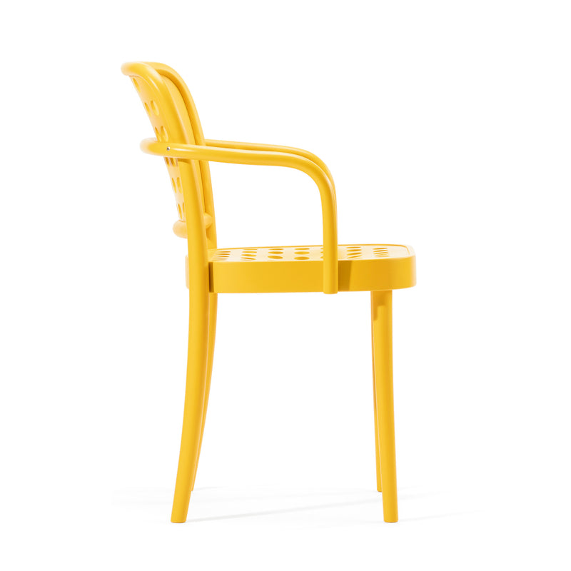 The Armchair 822 by TON showcases Scandinavian minimalism with its yellow perforated backrest and seat, complemented by smooth, rounded armrests. Its sleek design echoes Claesson Koivisto Runes aesthetic, elegantly presented from a side view.