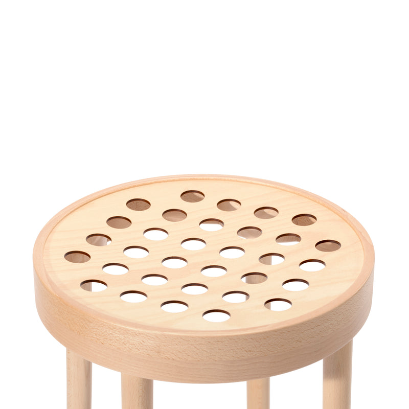 The Barstool 822 by TON epitomizes Scandinavian minimalism, featuring a smooth wooden seat with multiple circular holes and artfully bent four legs in a light natural wood finish, all displayed against a plain white background.