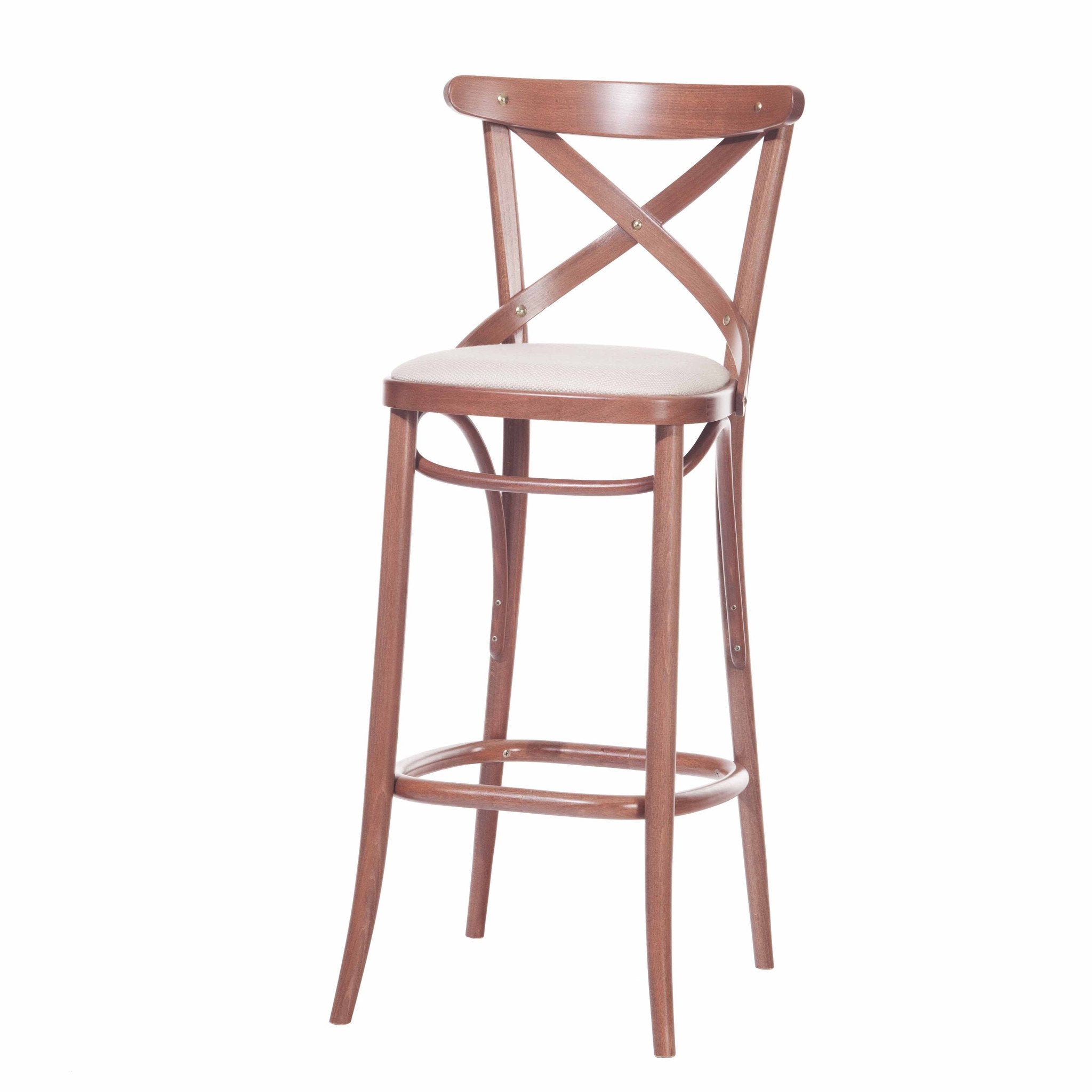 The Barstool 150 by TON features an X-back design and padded upholstery for comfort. Its tall, slender legs include a circular footrest, offering an elegant and classic look.