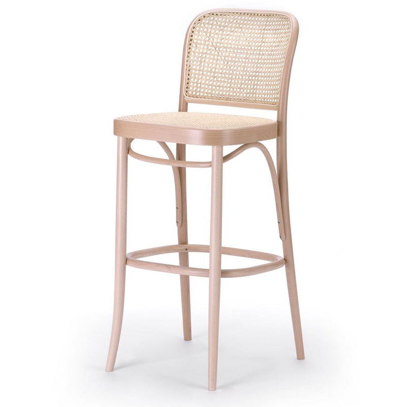 The Barstool 811 - Cane by TON is a minimalist, elegant piece crafted from bent beech wood, featuring a curved frame with a wicker backrest and seat, seamlessly blending style and functionality.