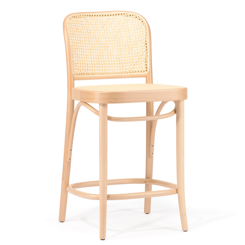 Experience the elegance of the TON Barstool 811 - Cane, featuring a bent beech wood frame and woven rattan backrest. Its curved design includes a smooth rectangular seat, slightly tapered legs, and supportive crossbars, blending style with function.