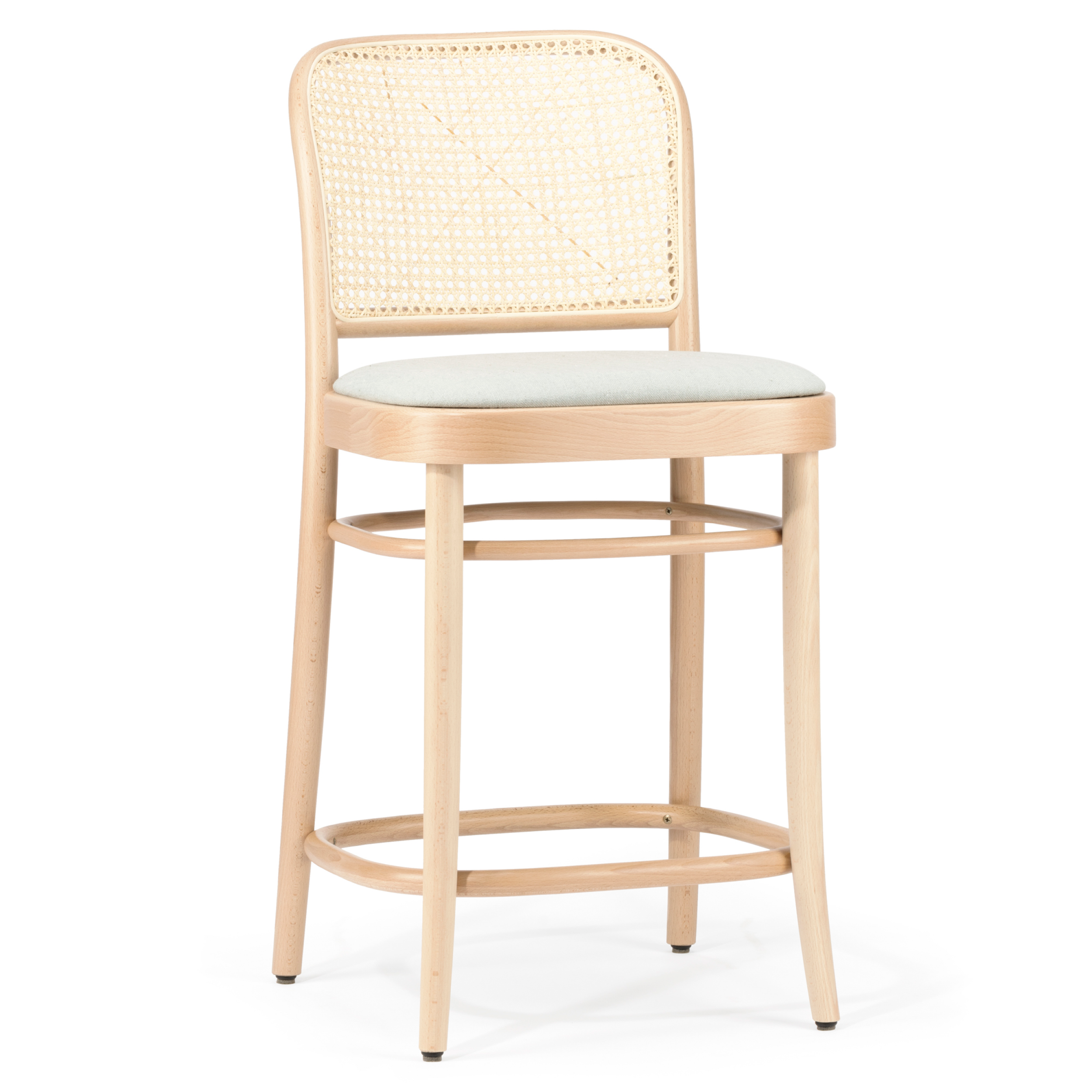 The Barstool 811 - Upholstered by TON is a wooden barstool with a cane mesh backrest, light fabric cushioned seat, and round beech wood frame. It features four legs and a circular footrest, showcasing minimalist and modern design elements.