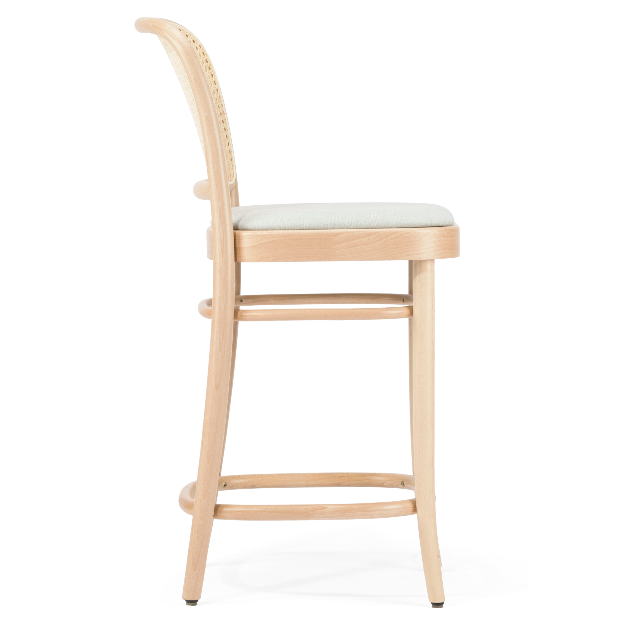 A profile view of the TON Barstool 811 - Upholstered, made from beech wood with a high backrest and light upholstery. It features curved accents, footrests, and stands against a white backdrop.