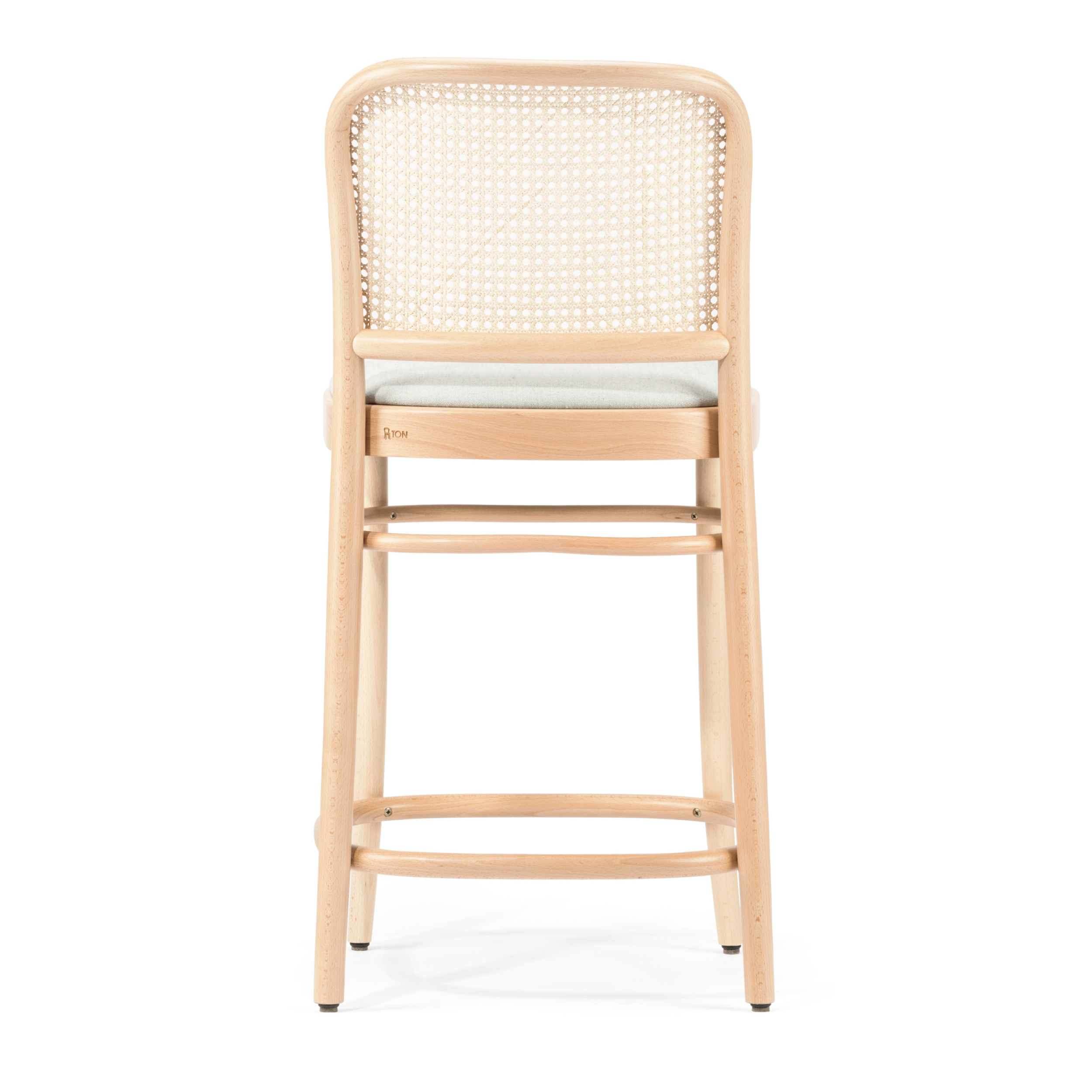 The Barstool 811 - Upholstered by TON is a minimalist beech wood stool with a natural finish, featuring a cane mesh backrest and light upholstered seat cushion, shown from the back.