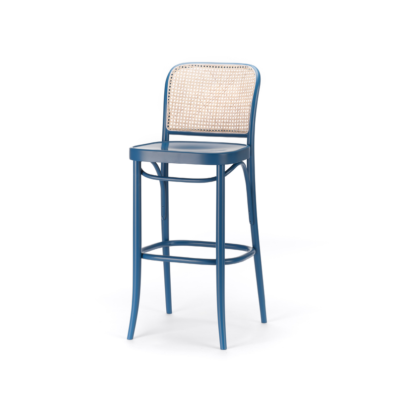 The Barstool 811 by TON features a blue finish with a sleek metal frame and woven cane mesh backrest, combining modern materials with a classic design. It includes a footrest for added comfort.
