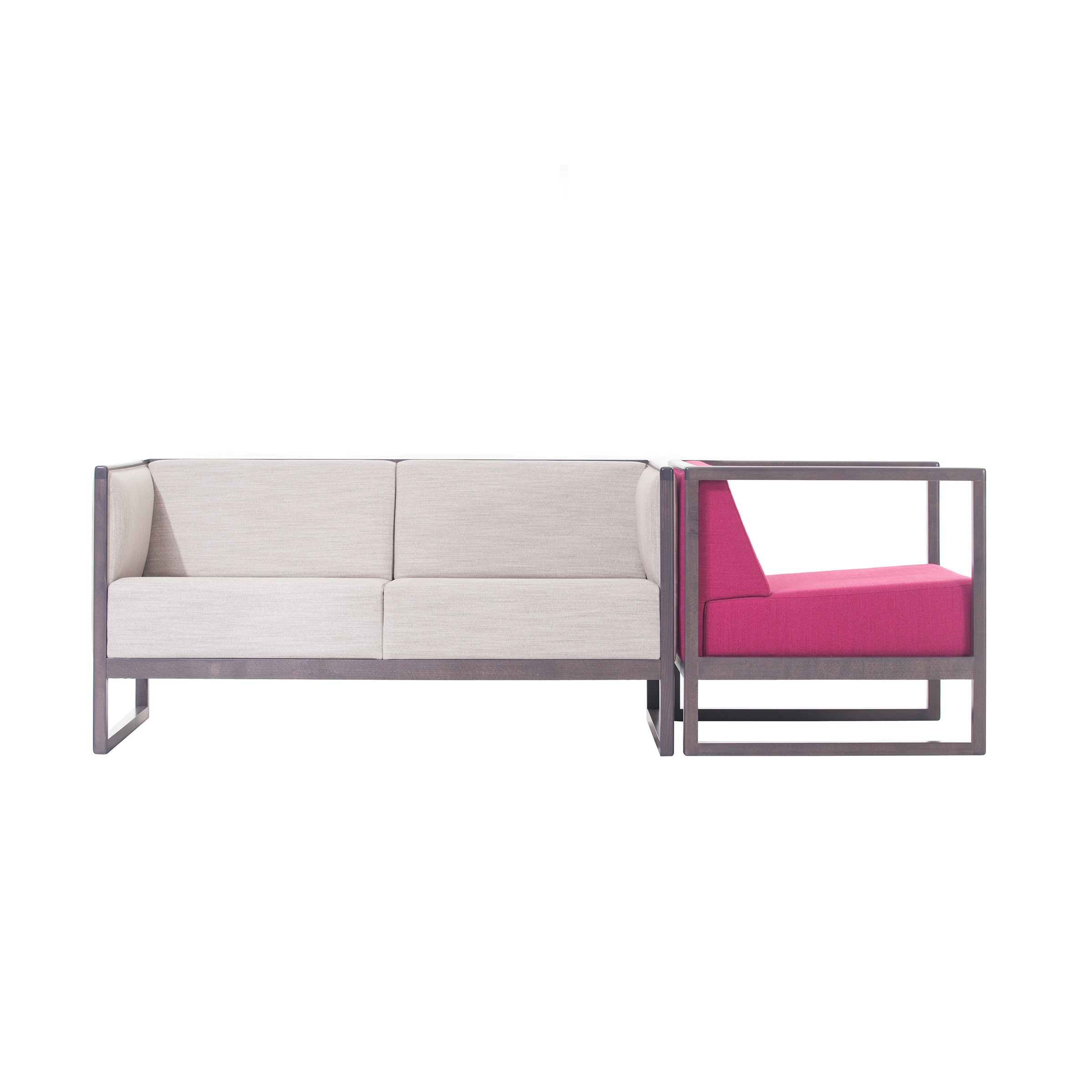 The Armchair Casablanca by TON is a modern, minimalist design featuring a pink lounge chair with sleek, rectangular wooden frames and cane weave armrests. This complements the white two-seater sofa, both upholstered and showcasing clean geometric lines.