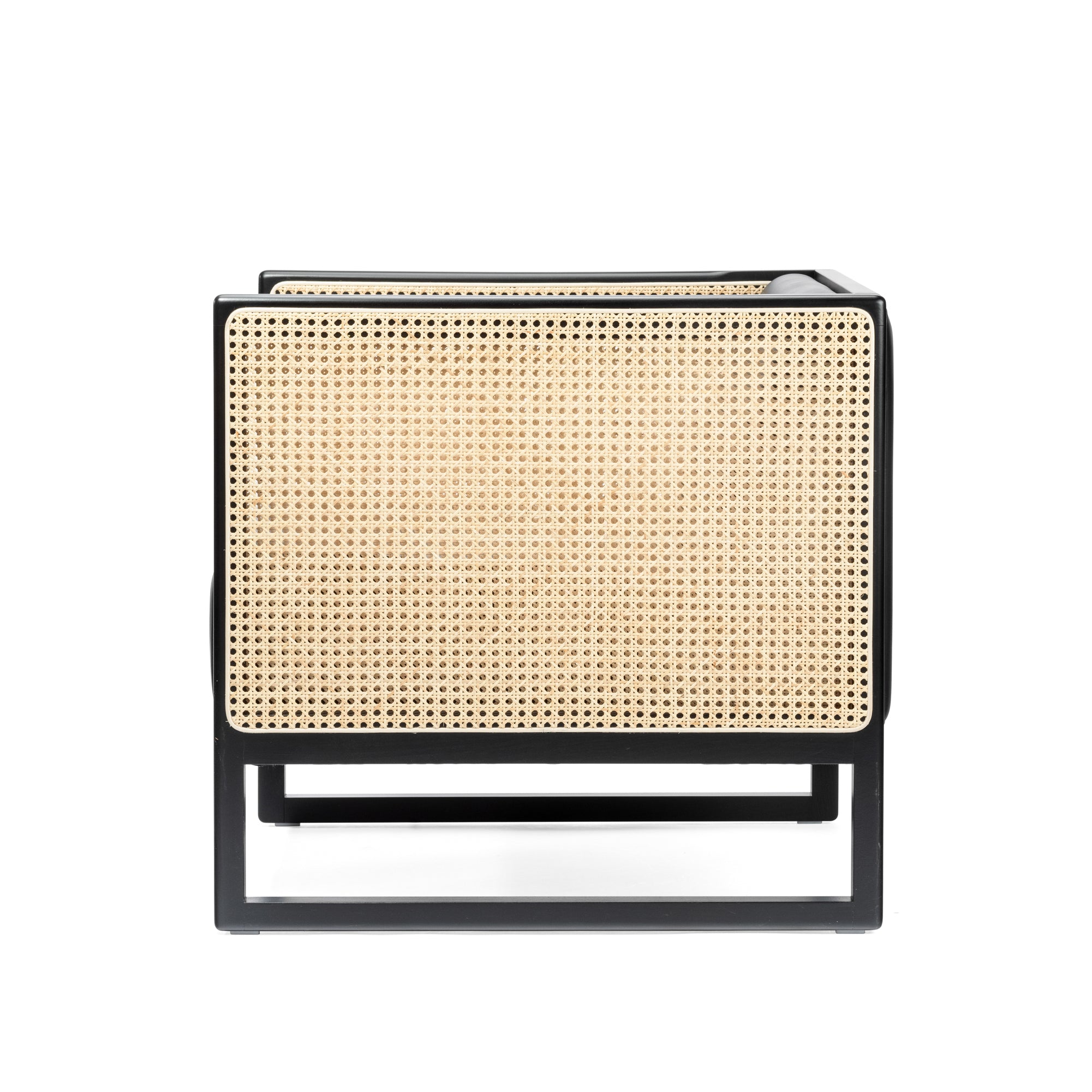 Front view of the Armchair Casablanca by TON, featuring a black frame and cane weave armrests. This design blends sleek lines with natural textures for a contemporary, minimalist look against a white background.