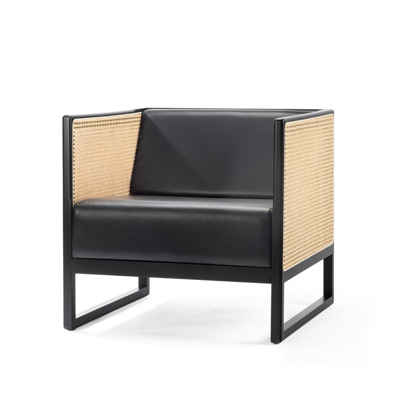 The Armchair Casablanca by TON is a modern black lounge chair featuring a sleek design with cane-weave armrests and a boxy frame, combining leather and natural materials for a minimalist contemporary aesthetic.
