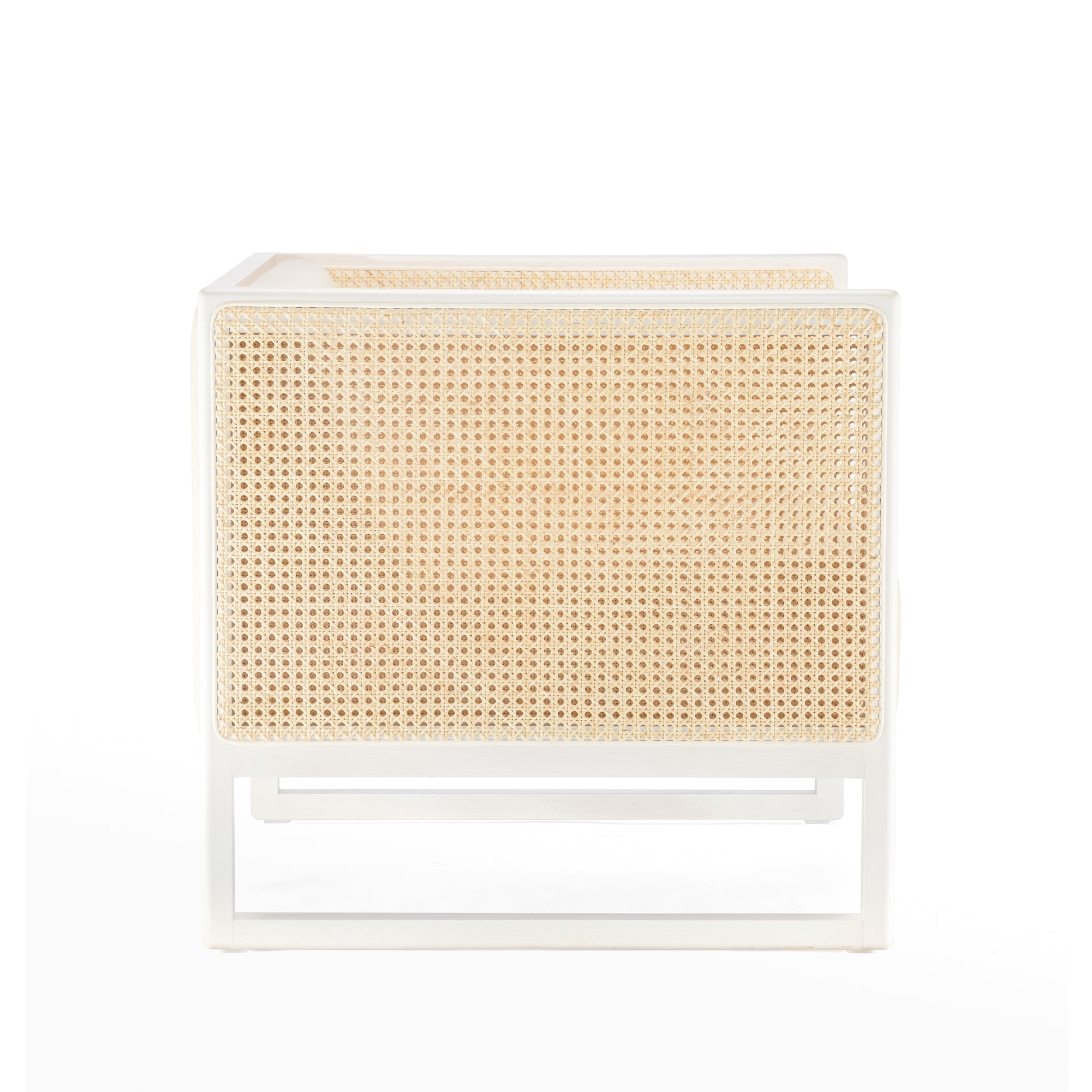 Side view of the Armchair Casablanca by TON, showcasing its stylish design with a white metal frame, wicker sides, and cane weave armrests. The modern chair blends contemporary and natural materials against a plain white background.