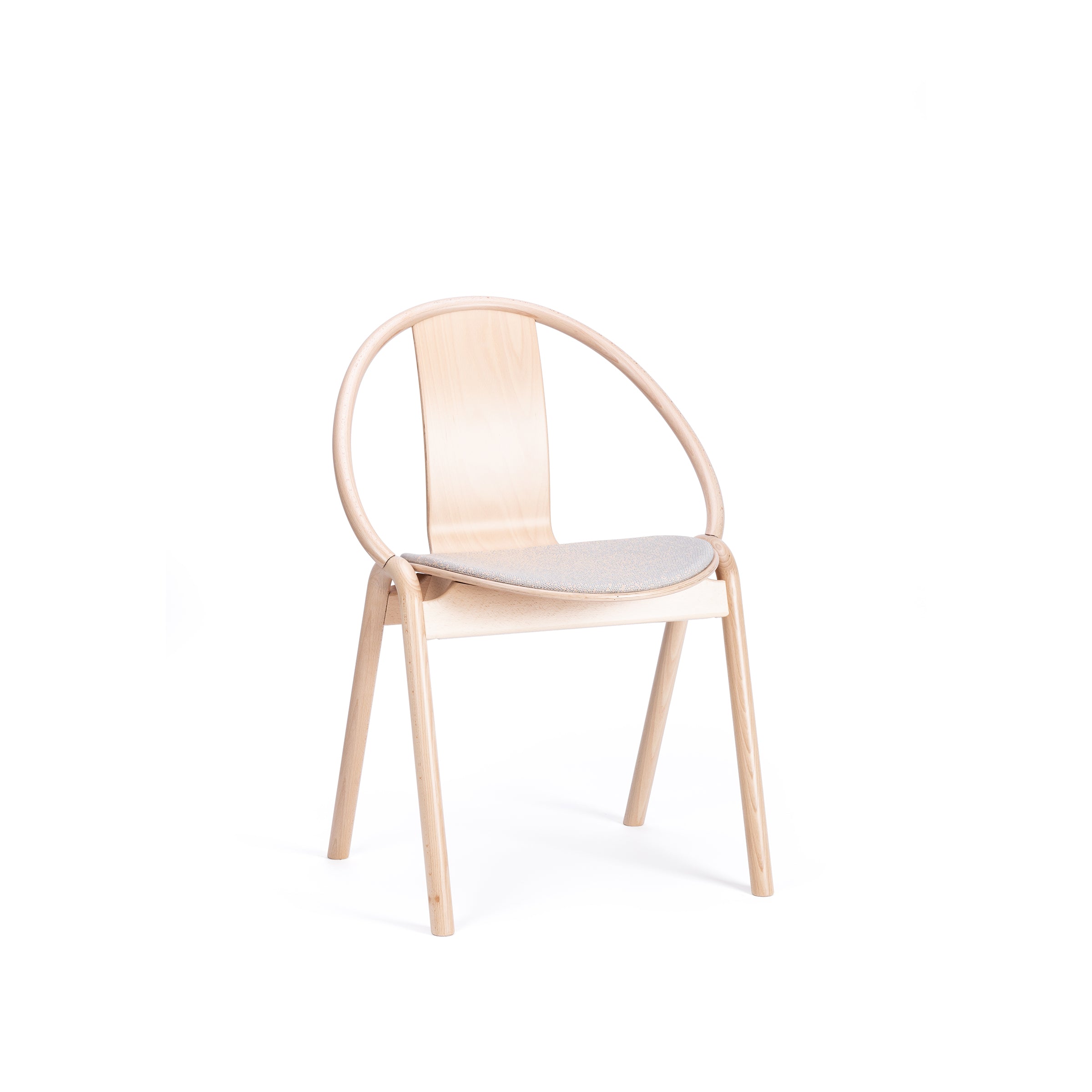 The Chair Again Upholstered by TON is a modern piece crafted from solid beech, with a curved backrest and light cushioned seat. Its minimalist design includes four straight legs and an elegant frame, embodying bentwood style against a white background.