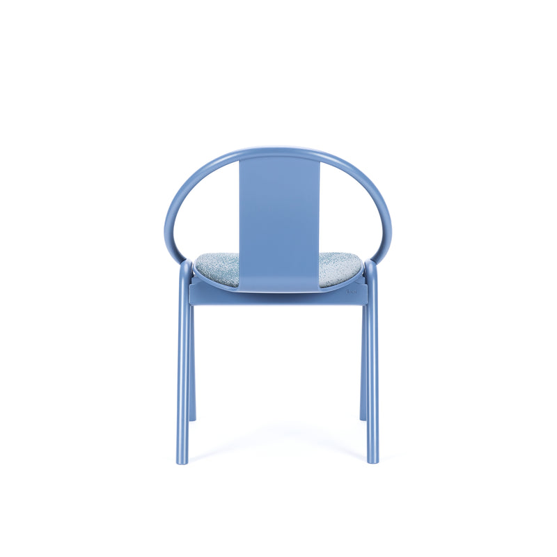 The Chair Again Upholstered by TON is a stackable dining chair with a light blue metal frame and round backrest. It features a speckled cushioned seat on four straight legs, set against a plain white background.