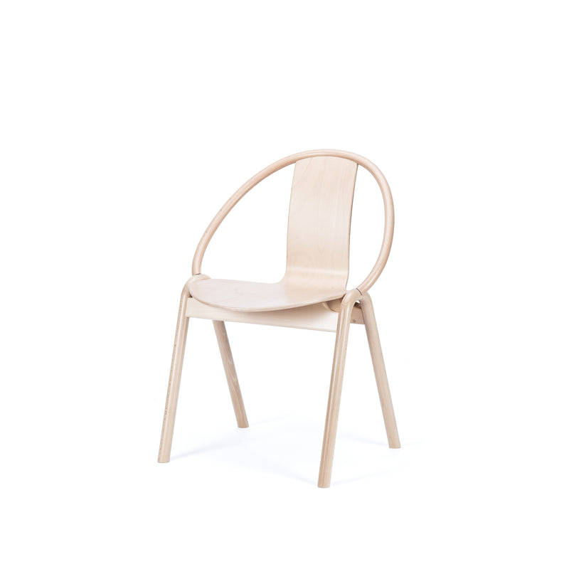 The Chair Again by TON is a minimalist bentwood chair with a curved backrest and four angled legs, made from light-colored wood, set against a white background.