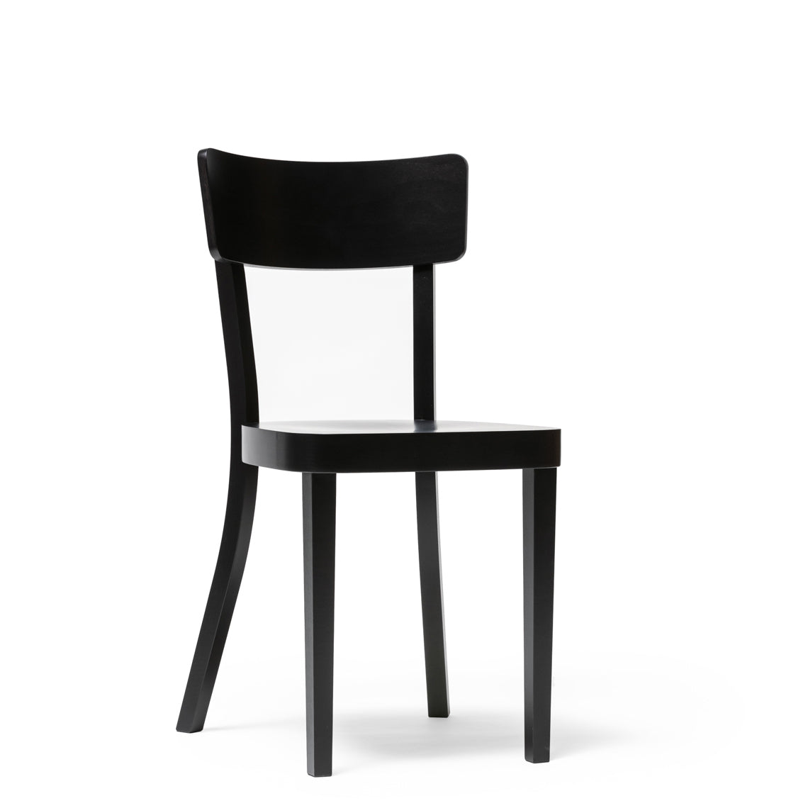 The Chair Ideal by TON is a sleek, modern black wooden chair with a curved backrest and four straight legs. It features an upholstered seat, making it perfect for dining. It stands out elegantly against a plain white background.