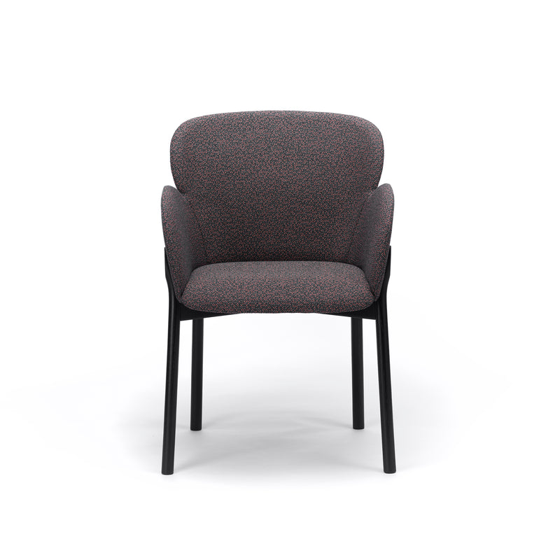 Front view of the Armchair Ginger by TON, highlighting contemporary design with a curved, padded backrest and textured fabric seat. It features four slender black legs for a minimalist, stylish look on a plain white background.