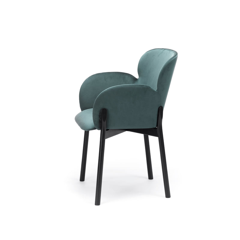 Introducing the Armchair Ginger by TON, a contemporary masterpiece with a teal upholstered seat and backrest, rounded armrests, and sleek black wooden legs crafted using TONs wood-bending technique for modern elegance.