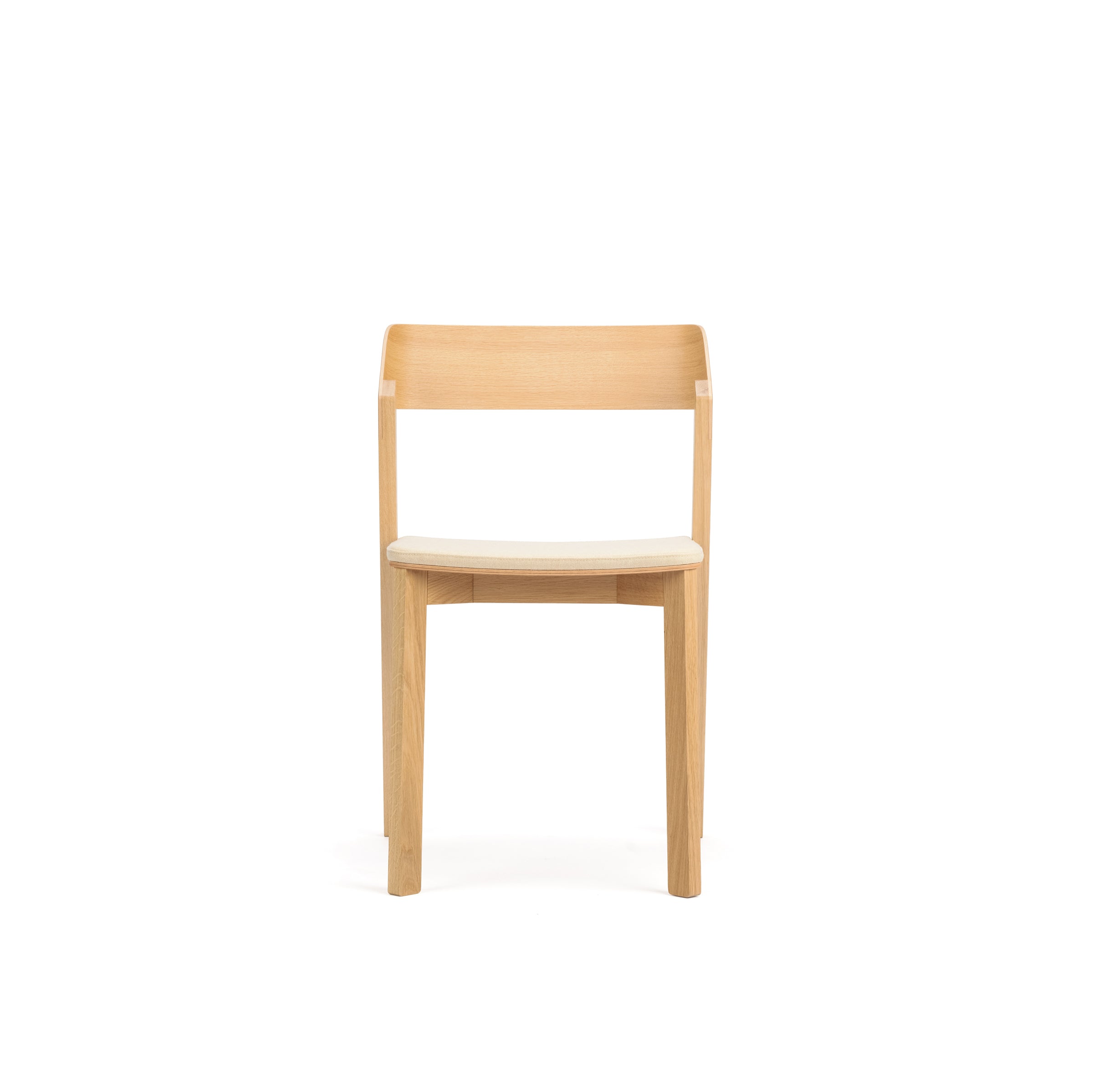 Discover the elegance of the Chair Merano - Upholstered by TON, a minimalist marvel with bent plywood and a light, natural finish. Enjoy its straightforward design featuring a straight backrest and flat seat, supported by four sturdy legs for timeless style and comfort.