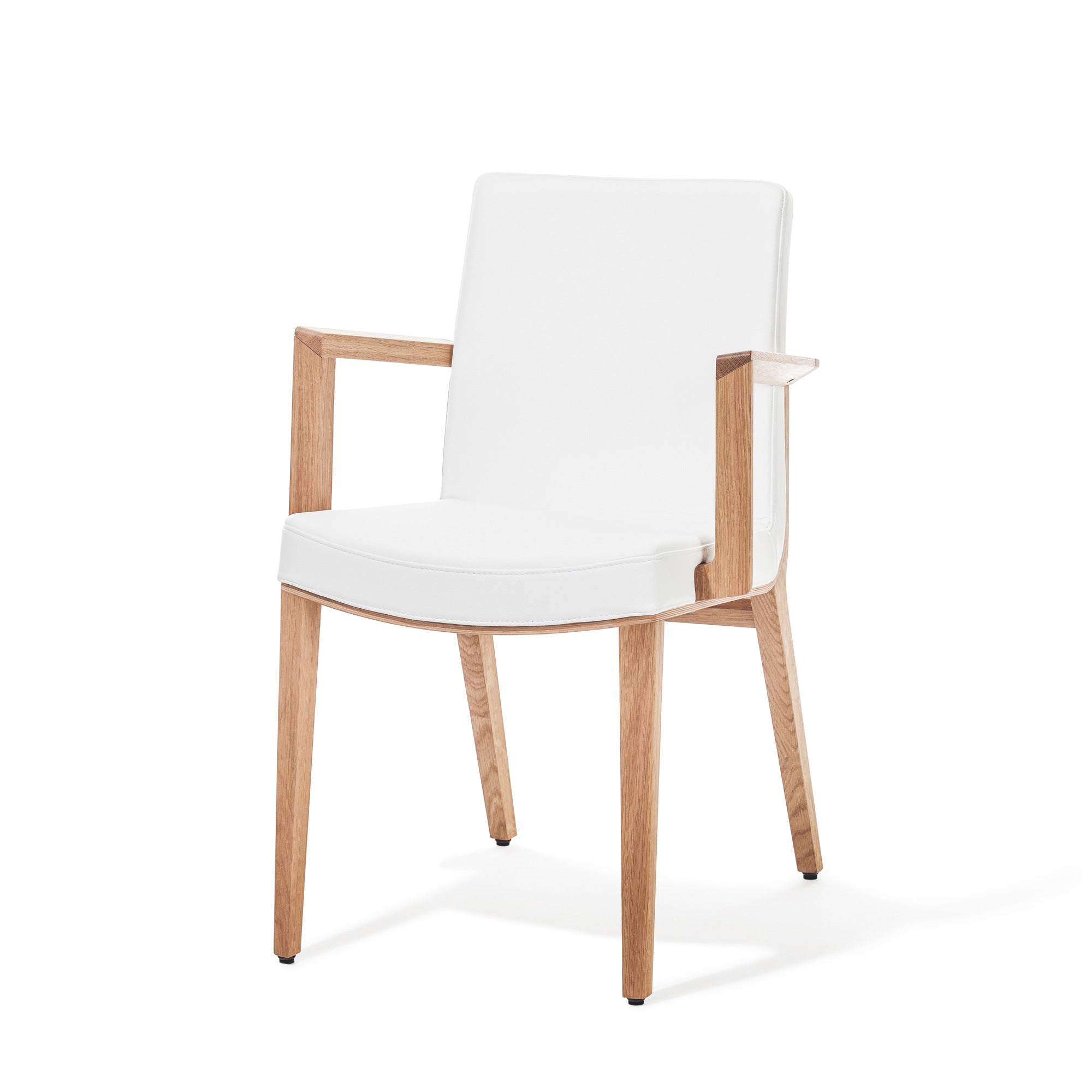 The Armchair Moritz by TON boasts a light wood frame and white cushioned seat and backrest. Designed with armrests and tapered legs, it reflects Kai Stanias modern minimalistic aesthetic, making it a premium addition to any space.