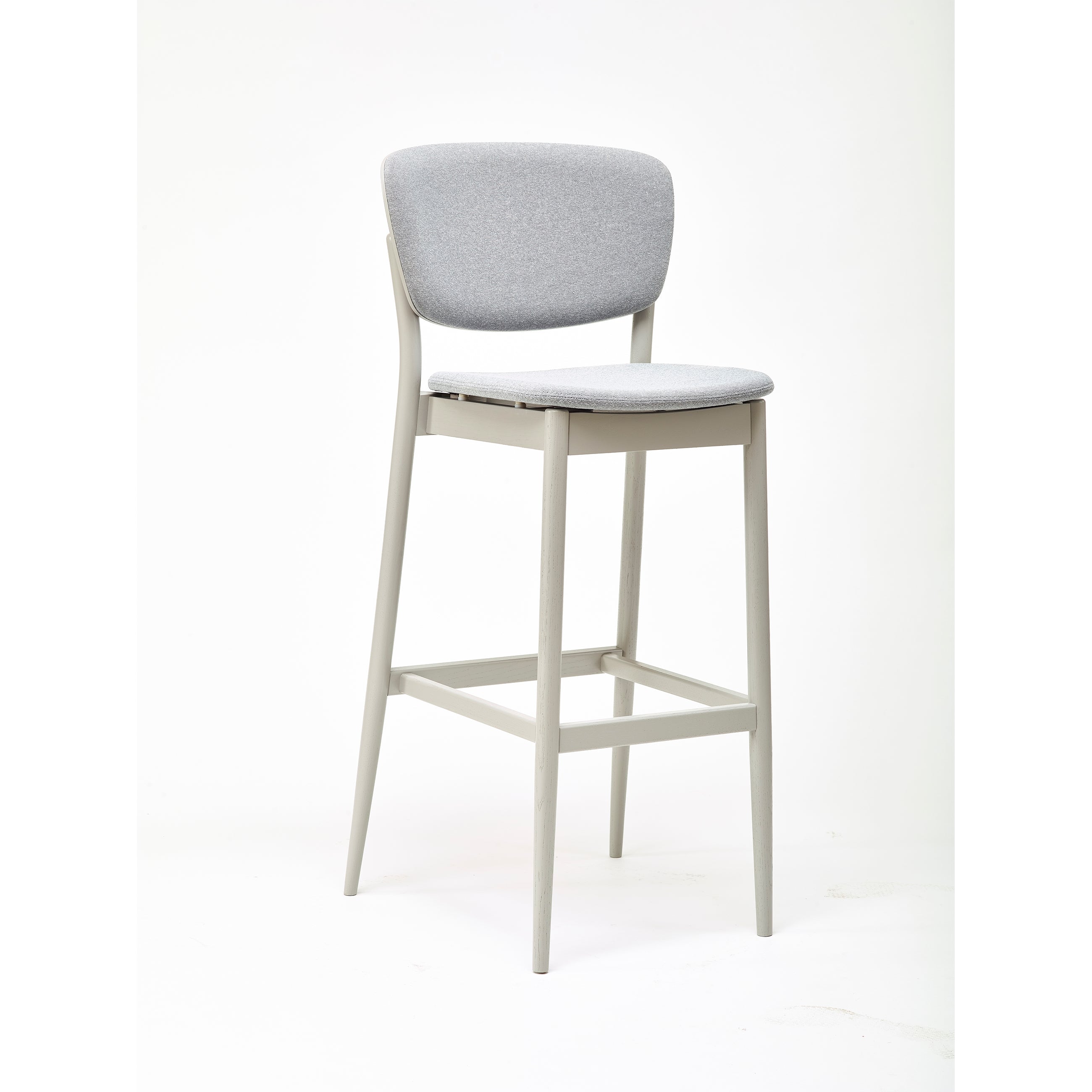 The Barstool Valencia by TON showcases a modern, minimalist design with a light gray padded seat and backrest. It offers barstool height options and features four straight legs connected by footrests, set against a clean white background.