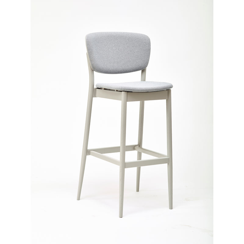 The Barstool Valencia by TON showcases a modern, minimalist design with a light gray padded seat and backrest. It offers barstool height options and features four straight legs connected by footrests, set against a clean white background.